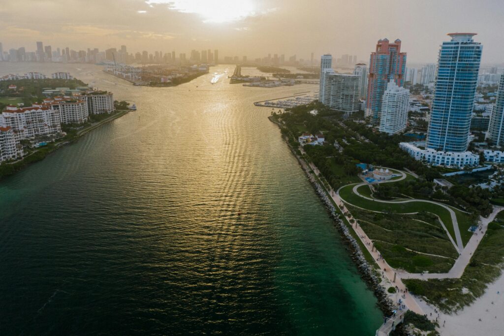 pexels-photo-9400901-9400901 Stunning aerial view of Miami skyline and ocean at sunset, capturing urban and natural beauty.